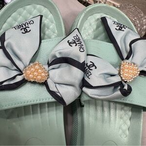 CHANEL Light Green Slides with Pearl Bow